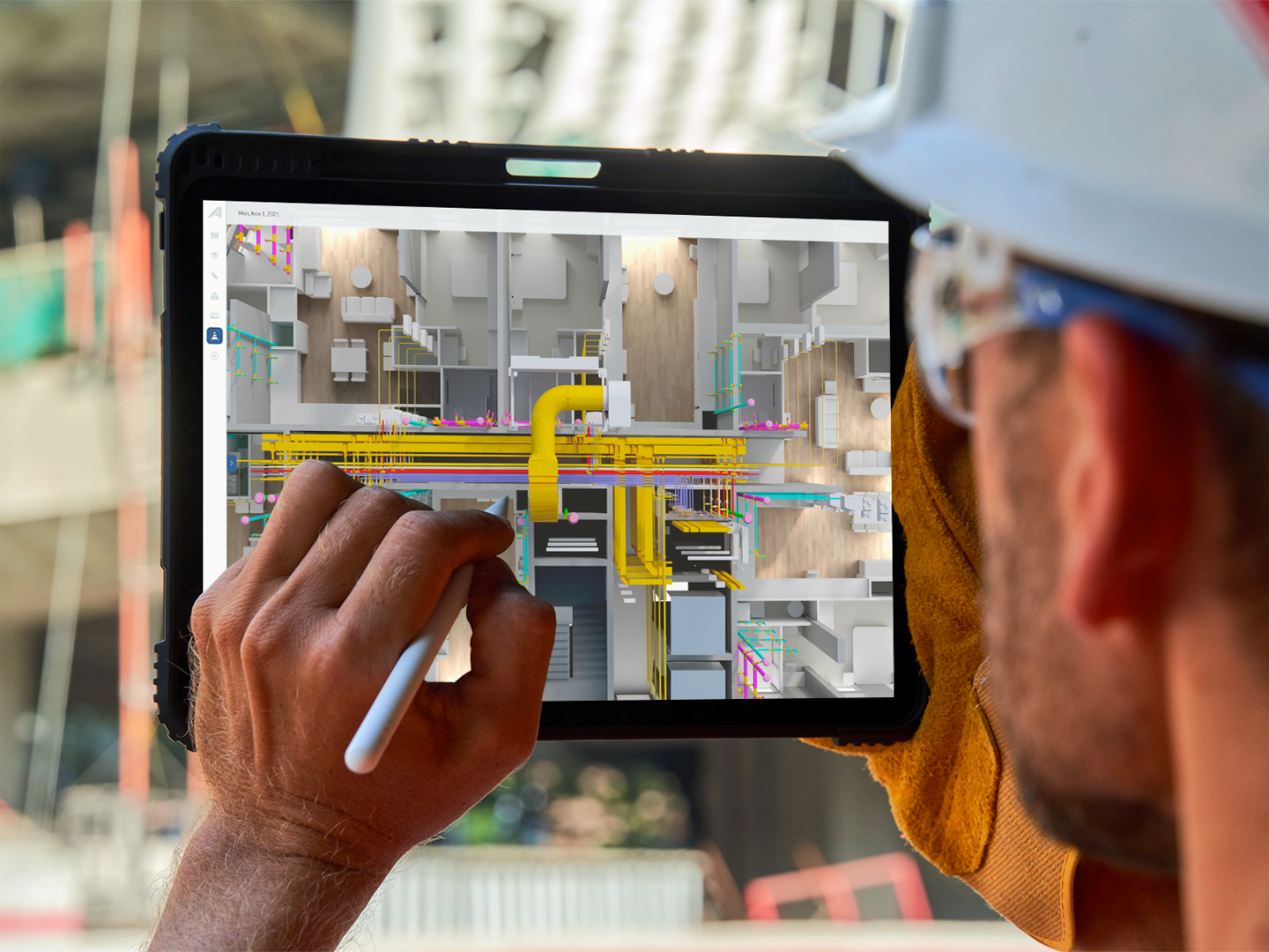 A site engineer using the platform on a tablet with a stylus